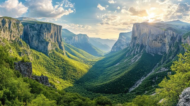 Panoramic view of the lush valley and steep rock walls of the Vikos Gorge in the Pindus Mountains