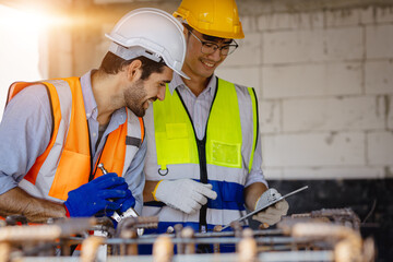 Two business man construction site engineer. Engineering objects on workplace with partners interacting on background