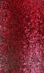 Abstract red and pink background with a textured, geometric pattern. The background is perfect for a variety of uses, including websites, social media, and print projects.