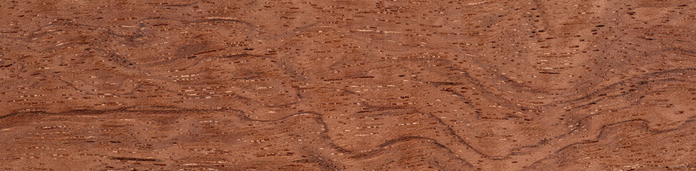 Bubinga pommele veneer with undulating grain patterns and warm terracotta tones