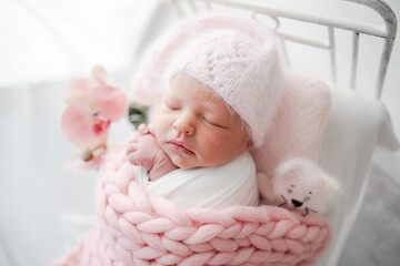 Newborn Baby Sleeps In Crib During Photo Session, Studio Picture Of Newborn Girl