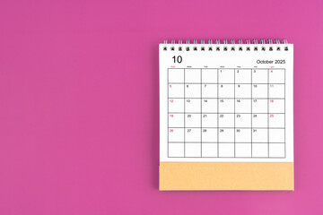 October 2025, Monthly desk calendar for 2025 year on purple background.
