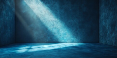 A dark blue room with a ray of light shining in from the left. The light creates a bright blue patch on the floor.