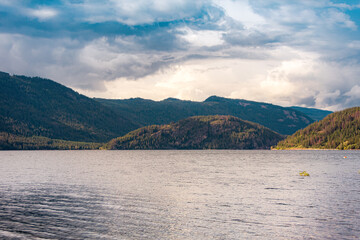 Cloudy Landscape with a Lake and Mountains