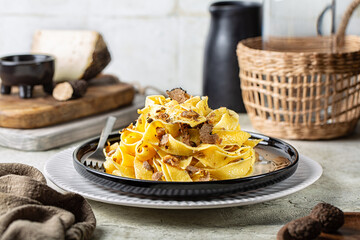 Truffle fettuccine with mushrooms, long egg pasta. Italian first course made with hard cheese and...