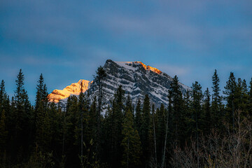 Sunset Illuminating a Mountain Peak Against a Blue Sky