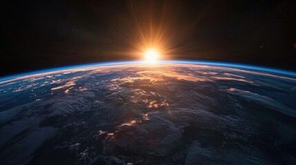 Fototapeta premium A beautiful image of Earth from space during sunrise, with a blue-toned light spreading over the horizon.