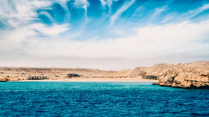 rocky coast of the Red Sea and.blue sky with clouds