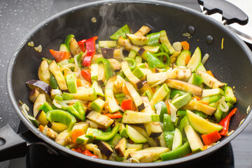 Cooking different veggies in frying pan