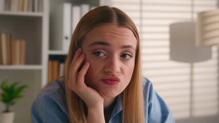Close up sad dissatisfied confused bored female face portrait stress offended woman Caucasian...