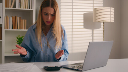 Confused frustrated Caucasian girl woman at office failure with documents stressed with papers...