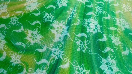 A seamless green floral pattern with stars and butterflies, creating a vintage and nature-inspired backdrop