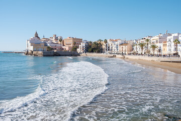 Obraz premium Sitges old town from San Sebastian beach 