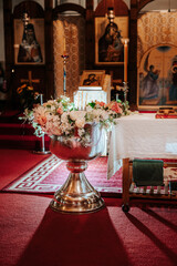 the interior of the Roman Orthodox church in Ireland, with a bible, a cross on the table
