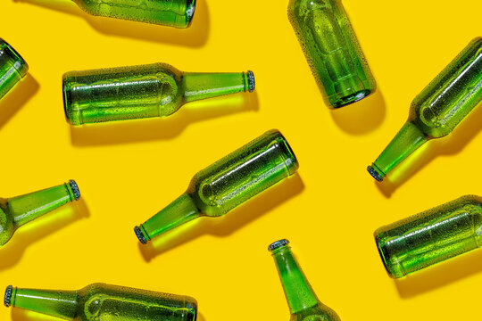A seamless, vibrant pattern featuring cold beer bottles
