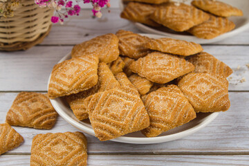 Plate of cookies on a light table. Sweet breakfast