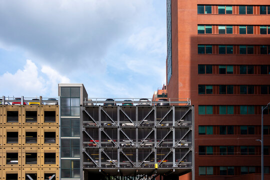 A vibrant building complex featuring a parking garage, with a mix of colors and architectural styles, representing urban development and modern city infrastructure in Rotterdam