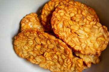 Crispy fried tempe, a typical Indonesian food on a white background