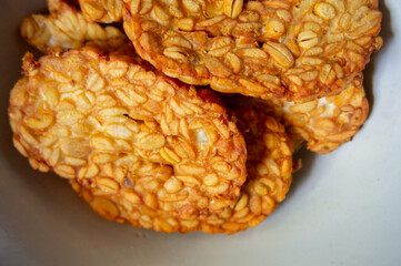 Crispy fried tempe, a typical Indonesian food on a white background