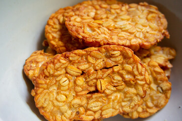 Crispy fried tempe, a typical Indonesian food on a white background