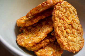 Crispy fried tempe, a typical Indonesian food on a white background