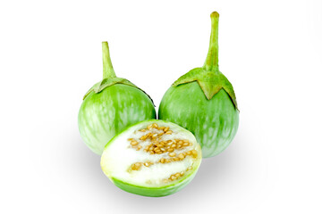 Thai egg plant or Ma khuea phro or Solanum virginianum L., whole and sliced isolated on white background with clipping path closed up stack. Essential ingredients in Thai curry, also eaten raw.