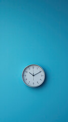 A Simple Clock Against a Vibrant Blue Background: Time's Passage in Minimalist Elegance