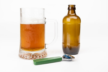 Beer Mug with Cold Beer, Empty Bottle, and Opener on White