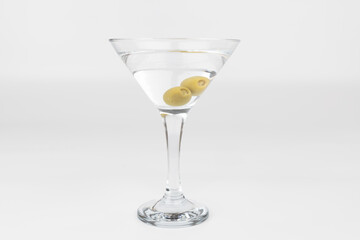 Martini Glass with Olives on a White Background