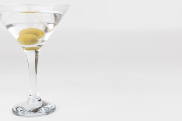 Classic Martini Glass with Olives on White Background