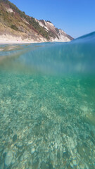 View of crystal clear sea water bay in the wild beach of Mezzavalle, Marche region