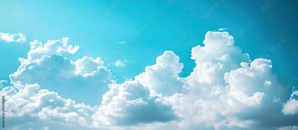 Aufkleber Light blue sky featuring white clouds suitable for a background or texture Copy space