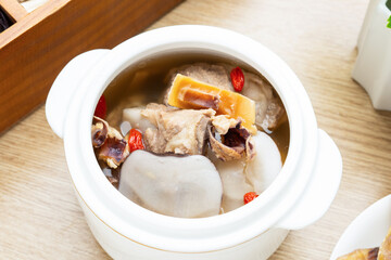 Chinese health soup - sea coconut slices stewed cuttlefish and pork bone soup