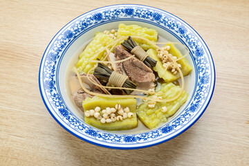 Guangdong traditional soup - rush, barley, bitter melon and pork bone soup