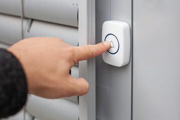 Naklejka premium Wireless Doorbell Mounted on Brick Wall