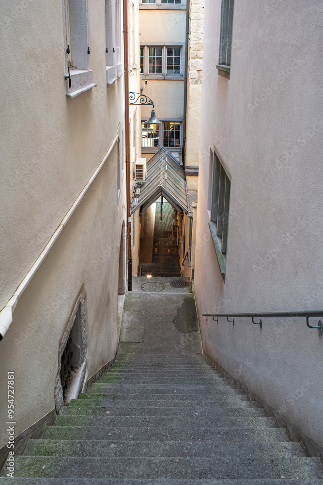 Wall mural narrow street alley and old architecture in a european city, no people