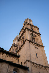 Fototapeta premium Grossmunster church towers in Zurich city Switzerland. Low, wide-angle view, sunny summer day, no people