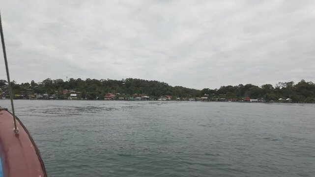 Sailing on calm waters with a view of distant shorelines of Bastimentos Island, Bocas del Toro
