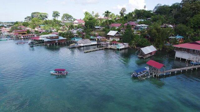 Colorful waterfront homes line the coast of Bastimentos Island in Bocas del Toro, Panama