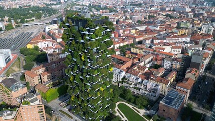 Italy ,Milan 09,05,2024 - Drone view of   Vertical forest, bosco verticale and Unicredit tower skyscraper in Garibaldi Gae Aulenti square financial district in downtown of the city - BAM , new skyline