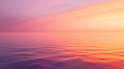 Obraz premium sunset over the sea, sky is vibrant with shades of orange, pink, and purple, blending seamlessly into the calm waters below