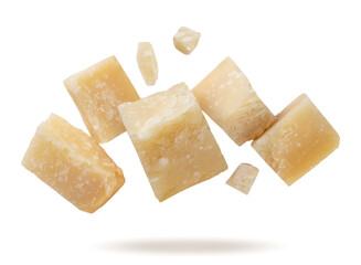 Parmesan cheese pieces flying on white background. Isolated
