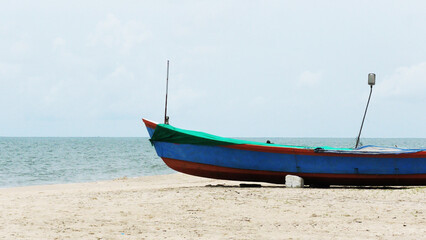 Fototapeta premium A fishing boat moored at Marari beach, Alappuzha, Kerala, India