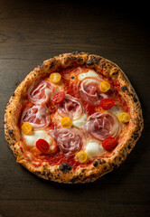 pizza with bacon, cherry tomatoes and buffalo mozzarella