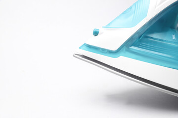 Modern iron for ironing close-up details on a white background