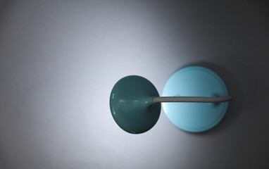 LED table lamp glows on a gray background. Top view