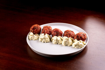 close up of portion of meatloaf with Madeira mayonnaise at happy hour pub tapas