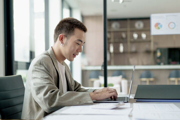 Young adult Creative startup Gen z male working at coworking space.