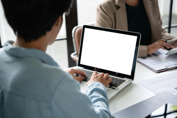 Asian business people working with laptop at office, empty white screen.