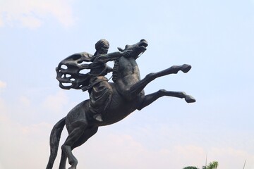 Diponegoro statue riding a horse at Monas Jakarta, Indonesia.